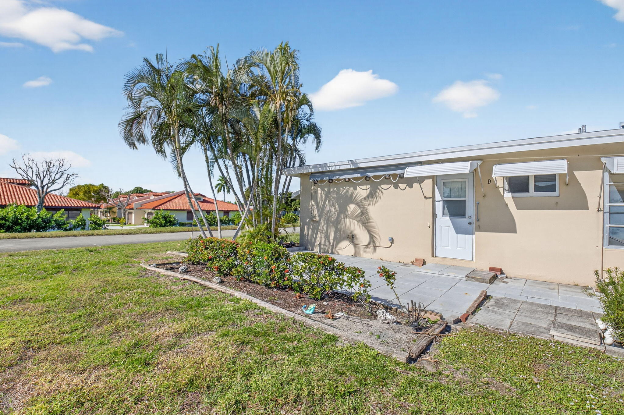 270 High Point Court, Unit D Boynton Beach, FL 33435 - Photo 32 of 41 a front view of a house with garden