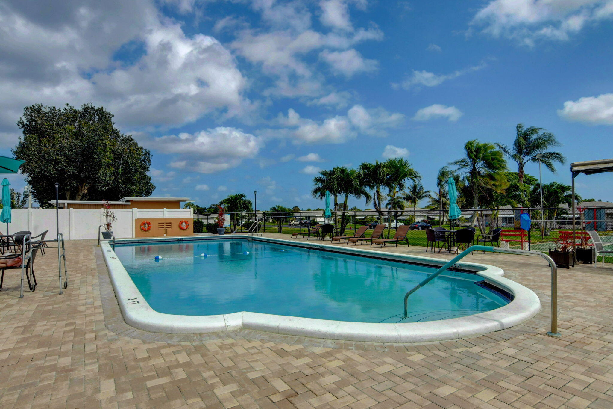 270 High Point Court, Unit D Boynton Beach, FL 33435 - Photo 37 of 41 a view of a swimming pool with outdoor seating
