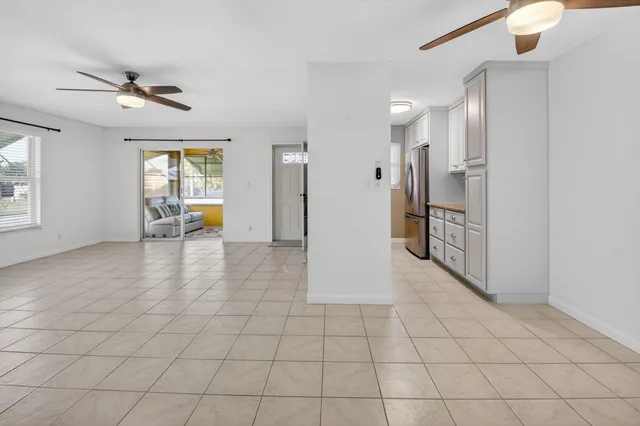 a view of a livingroom with furniture and an entryway