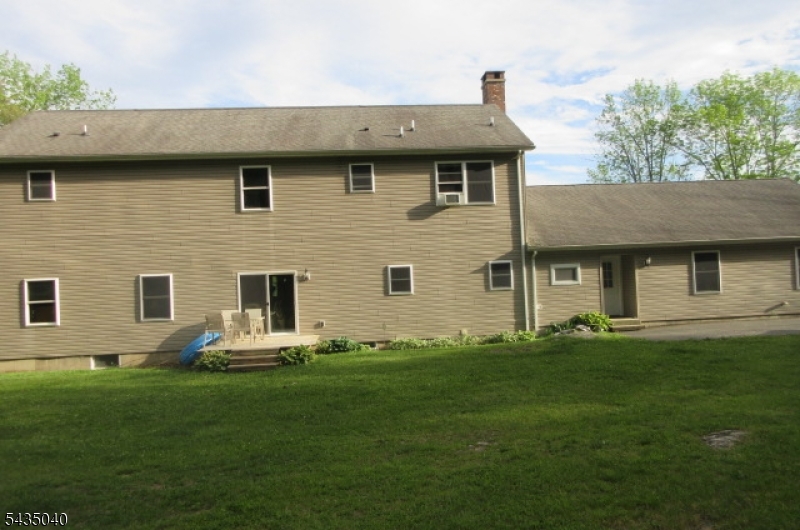 28 Beaver Run Road Lafayette, NJ 07848 - Photo 9 of 36 a front view of a house with a garden