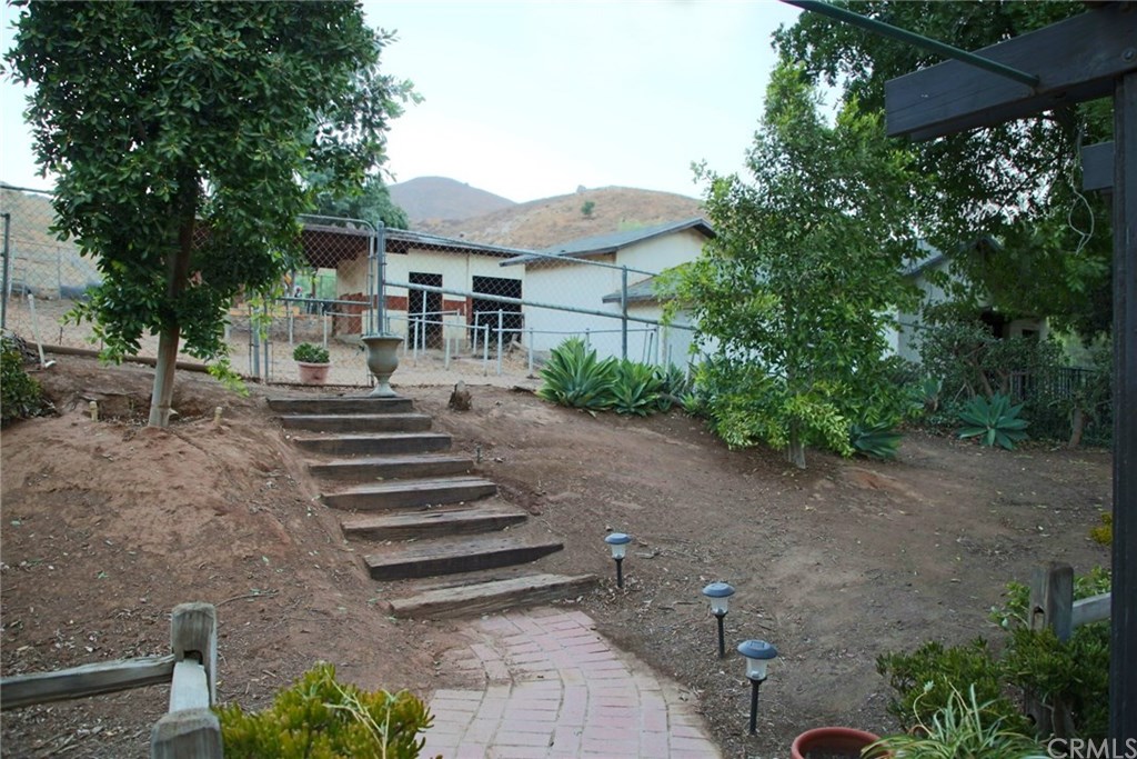 6168 Alhambra Avenue Riverside, CA 92505 - Photo 22 of 29 View from kitchen door of the barn and horse stalls, and hiking/riding hills beyond that.