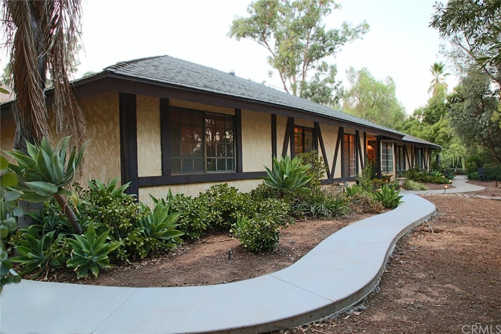 6168 Alhambra Avenue Riverside, CA 92505 - Photo 4 of 29 View of front of home from the far left corner, looking towards the front door and the driveway.