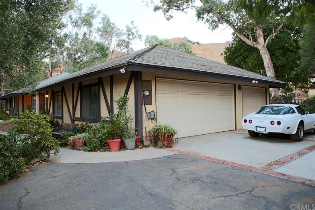 6168 Alhambra Avenue Riverside, CA 92505 - Photo 5 of 29 Other side of the house, at the 3-car garage with extra parking. Note the hills behind the house.