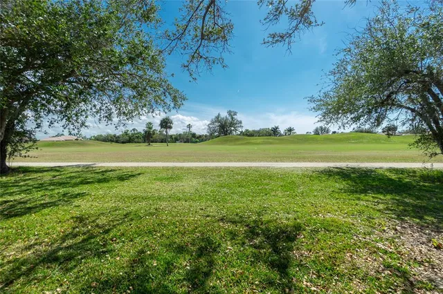 a view of a golf course with a lake