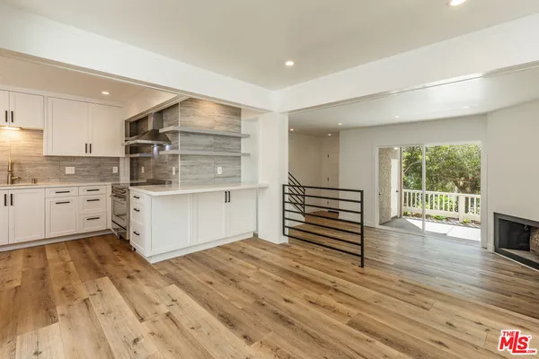 a kitchen with stainless steel appliances a sink and cabinets