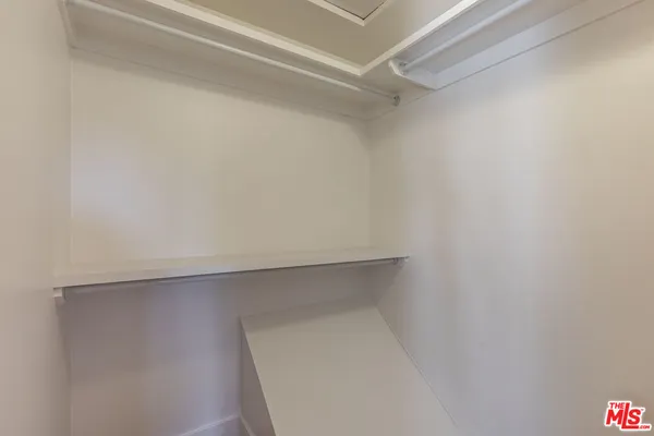 a view of an empty walk in closet