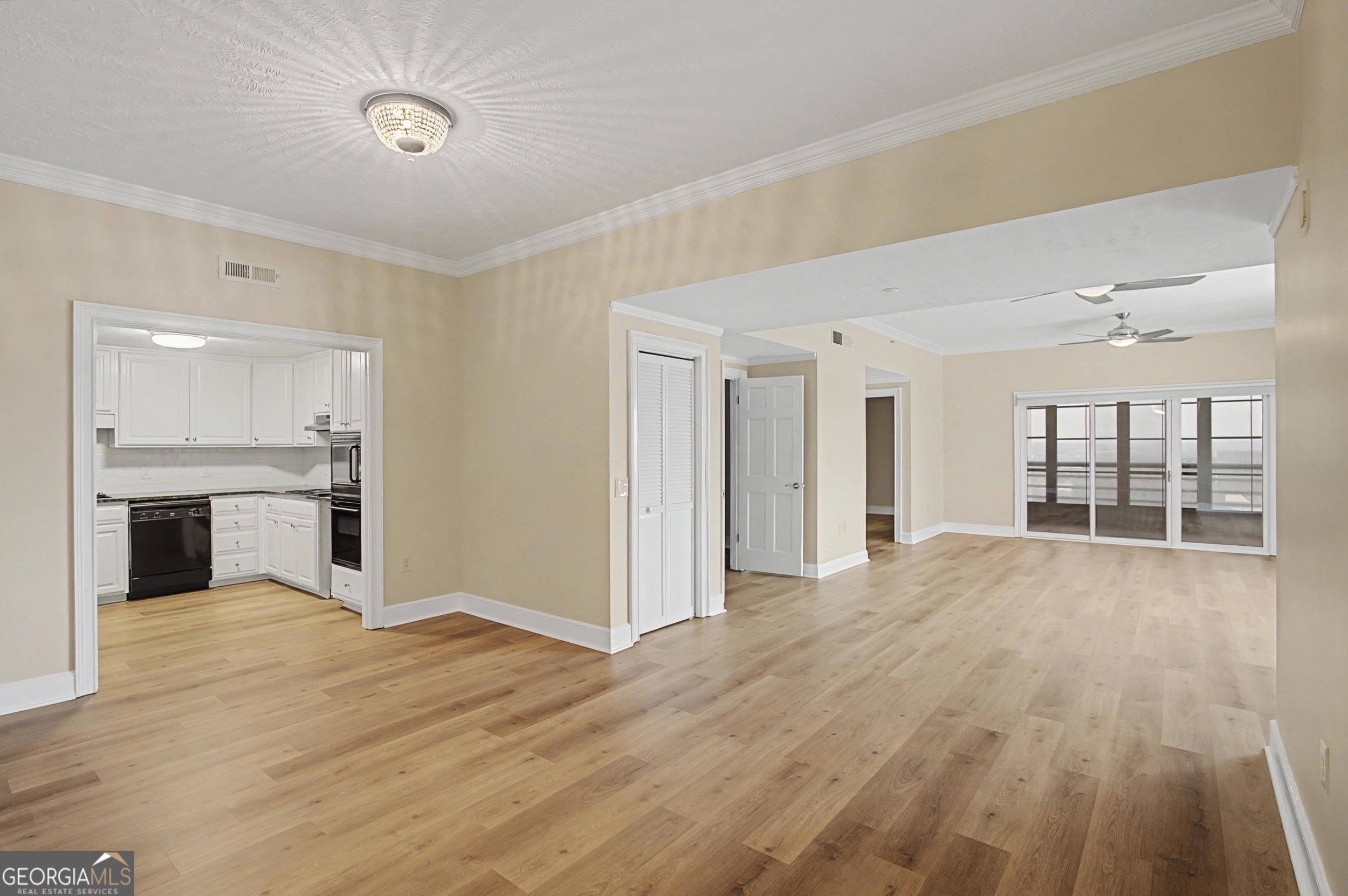 1 7th Street, Unit 1402 Augusta, GA 30901 - Photo 12 of 38 a view of an empty room with window and wooden floor