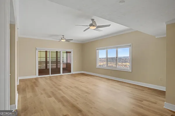 a view of an empty room with a window