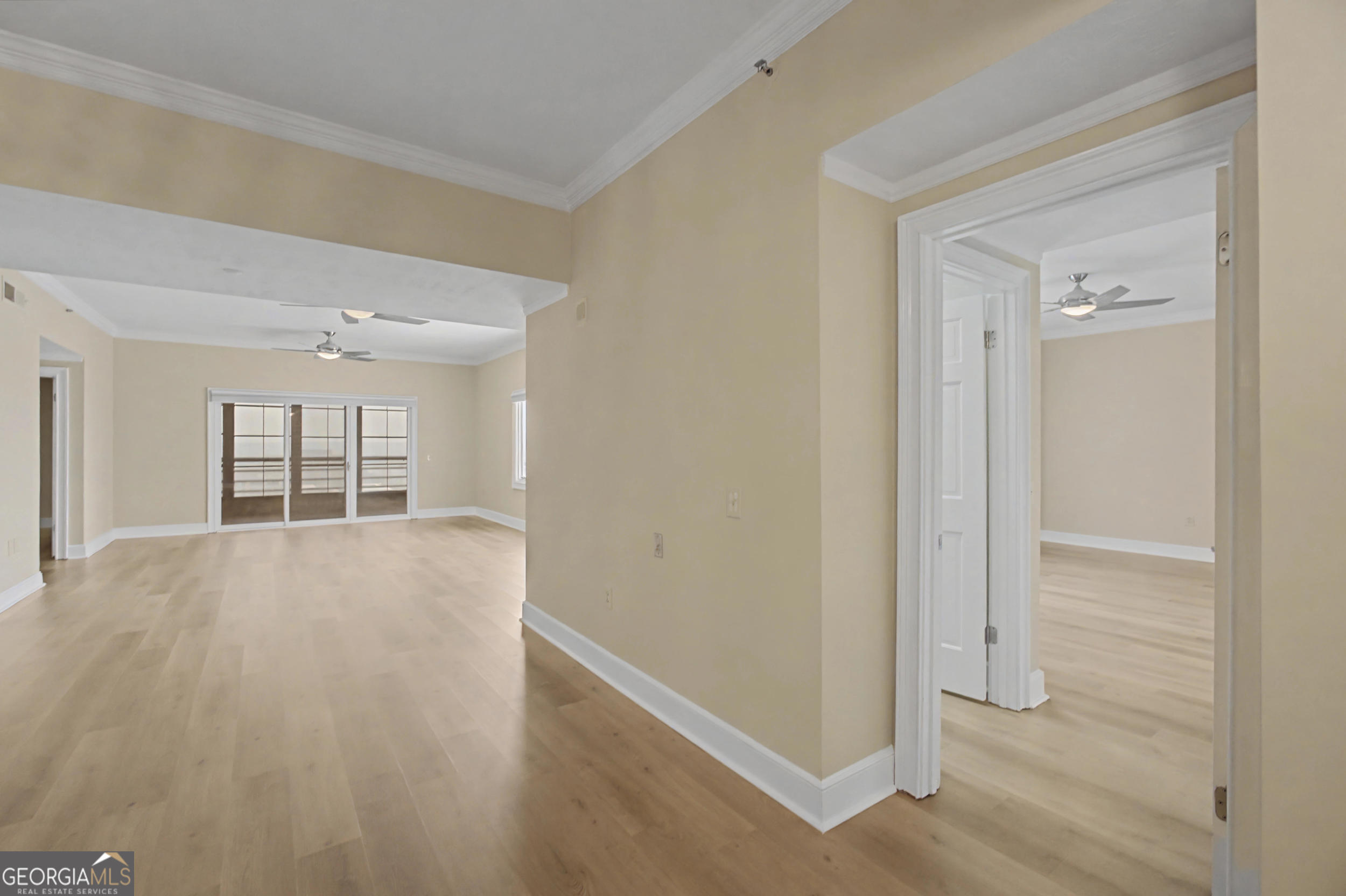 1 7th Street, Unit 1402 Augusta, GA 30901 - Photo 16 of 38 a view of empty room with wooden floor and fan