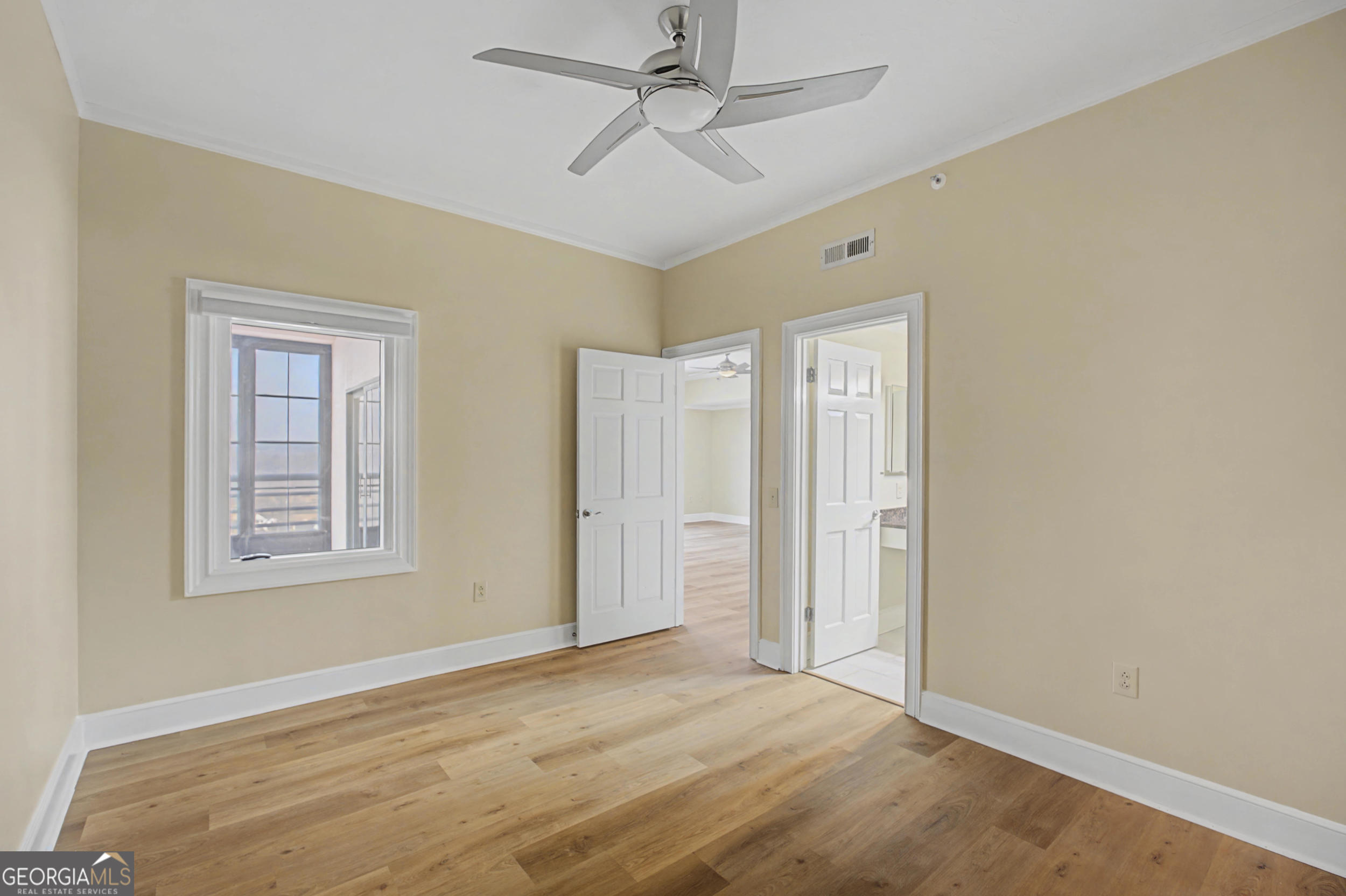 1 7th Street, Unit 1402 Augusta, GA 30901 - Photo 26 of 38 a view of an empty room with a window