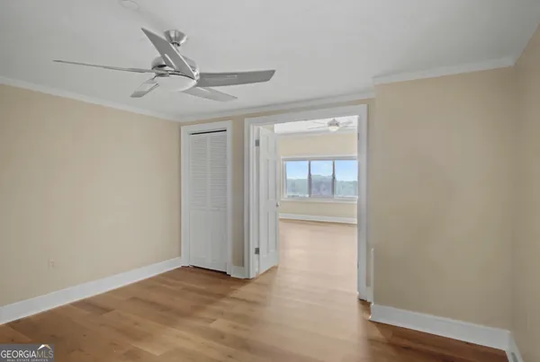 a view of a room with wooden floor and wooden roof