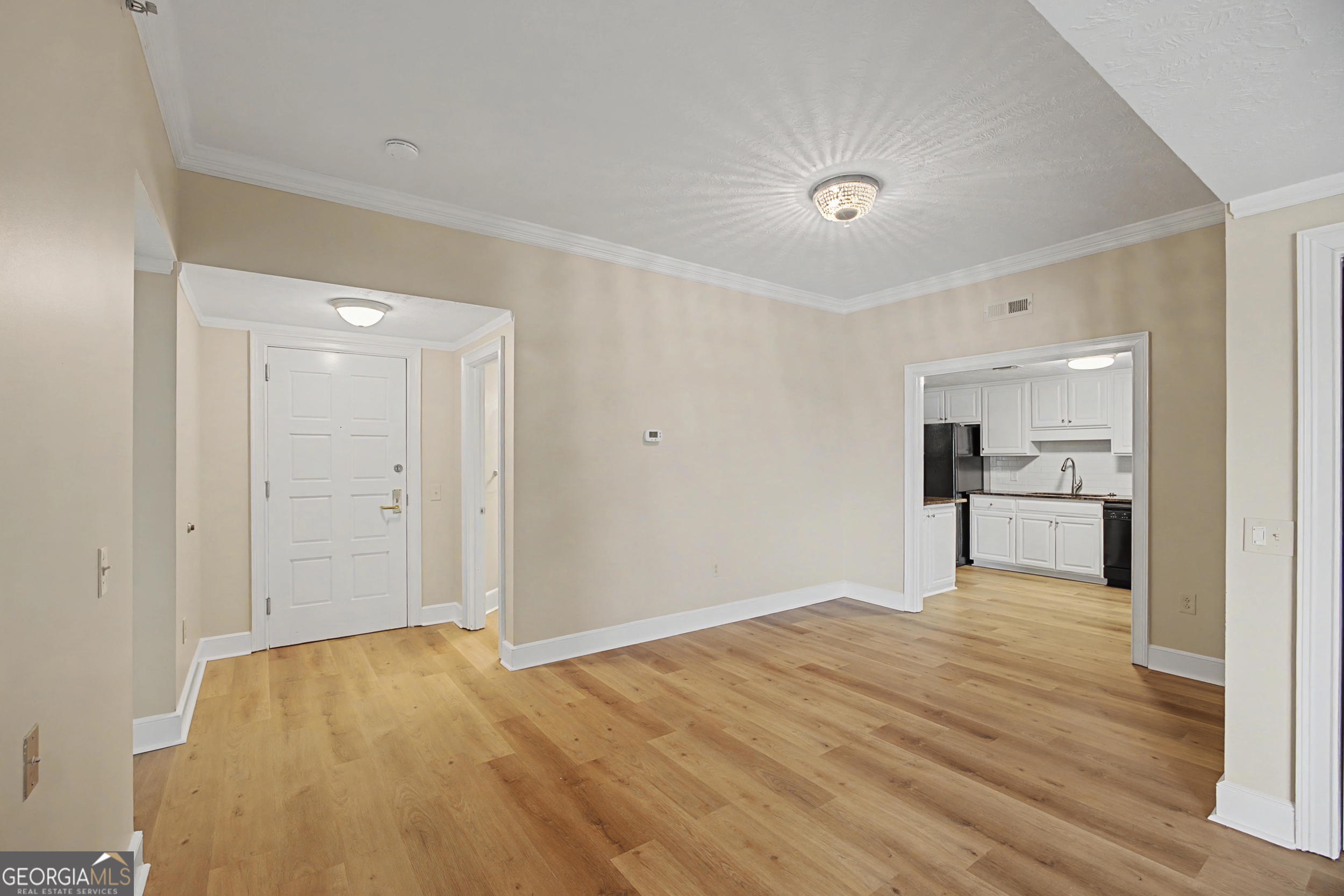 1 7th Street, Unit 1402 Augusta, GA 30901 - Photo 6 of 38 a view of a kitchen with wooden floor and a sink