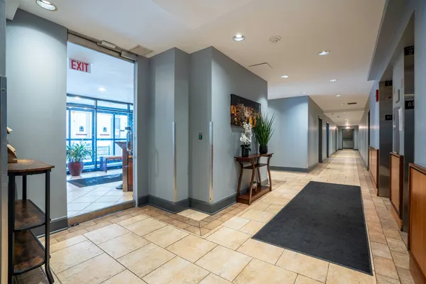 a lobby with furniture and a hallway