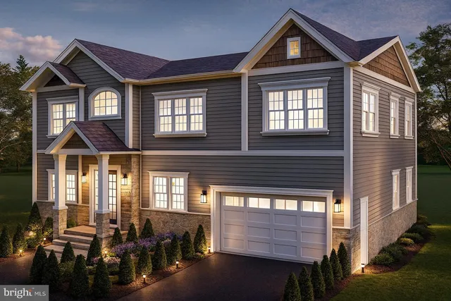 a front view of a house with many windows