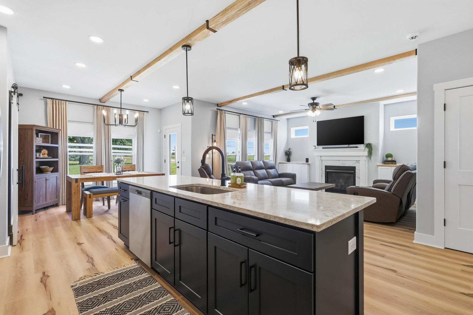 6779 Genesis Way Bettendorf, IA 52722 - Photo 9 of 36 a kitchen with sink stove and chairs