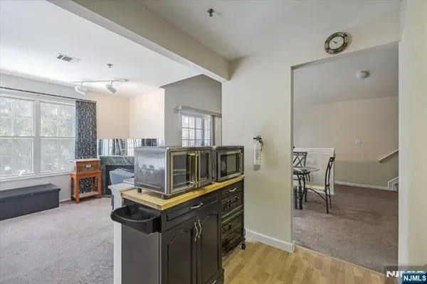 a living room with chairs and a table