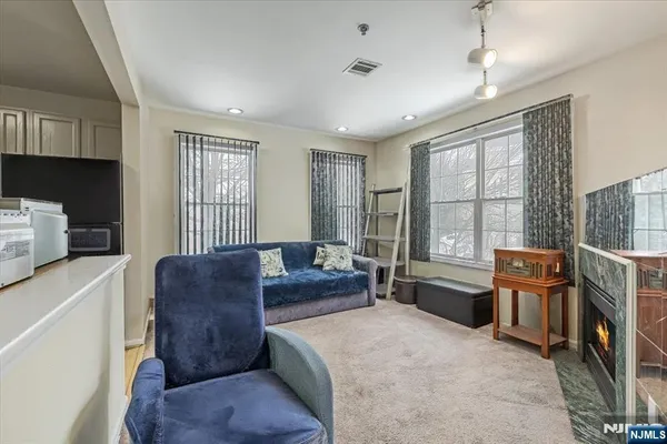 a bedroom with a bed dresser and a window