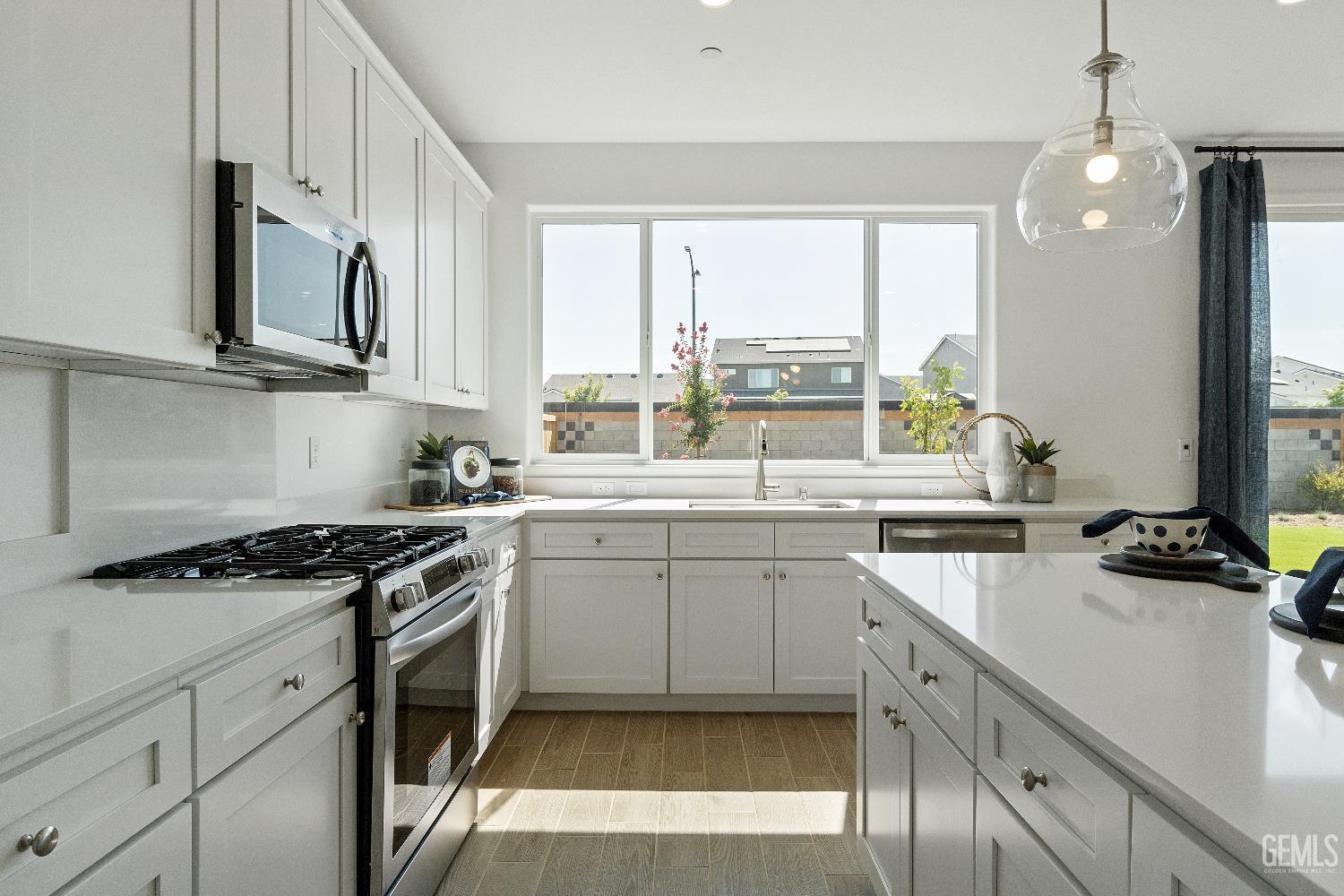 Undisclosed Address Shafter, CA 93263 - Photo 9 of 21 a kitchen with stainless steel appliances granite countertop a sink a stove and cabinets