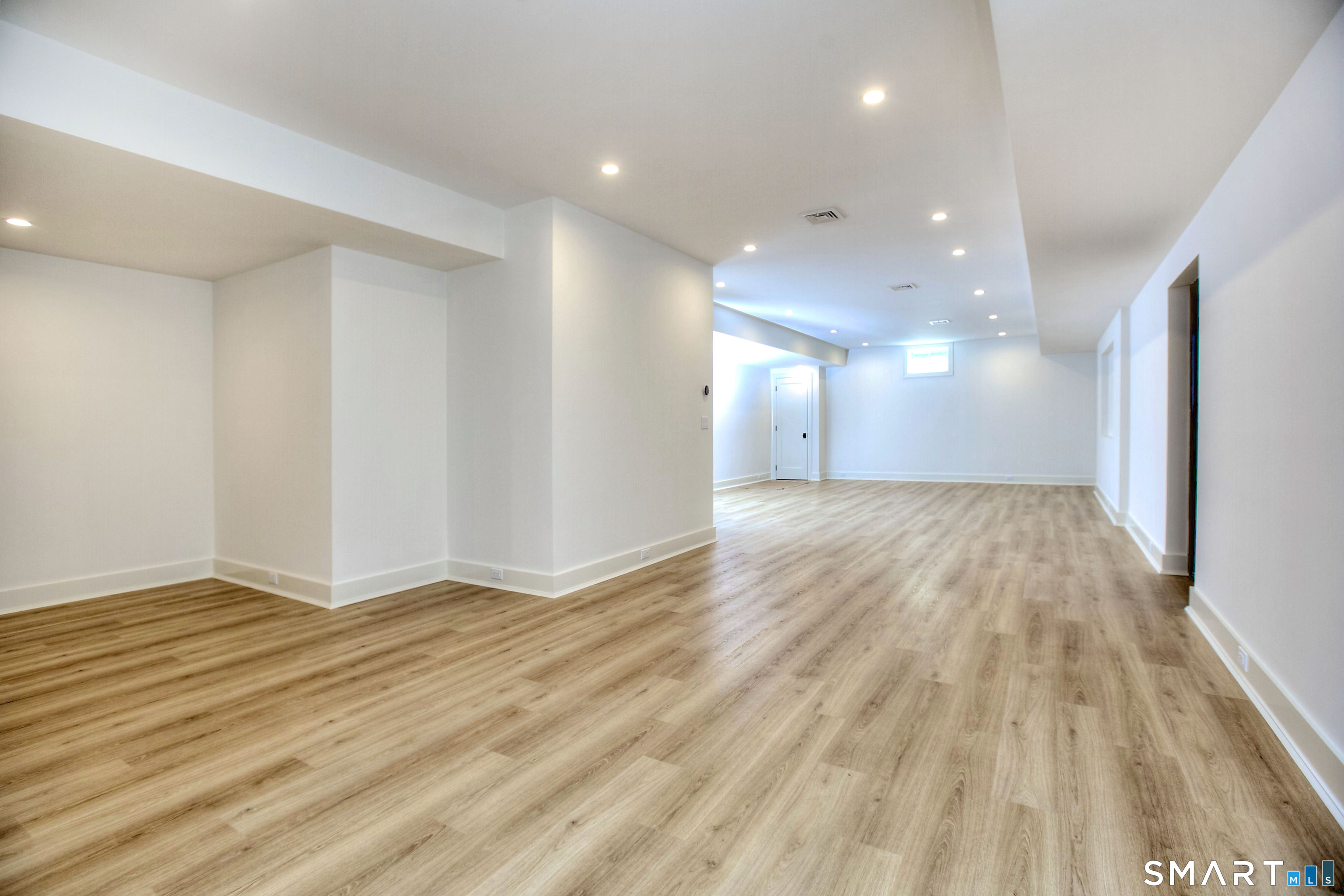 48 Kettle Creek Road Weston, CT 06883 - Photo 34 of 40 a view of a big room with wooden floor