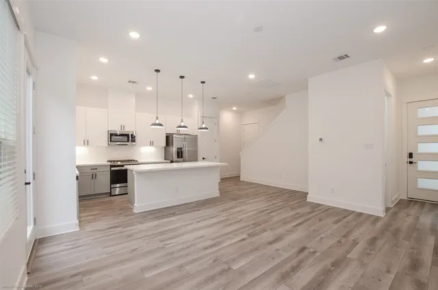 a view of kitchen with wooden floor