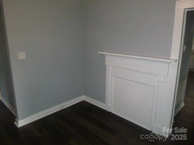 an empty room with wooden floor