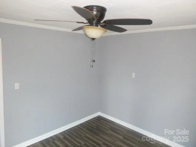 a view of a small space with wooden floor