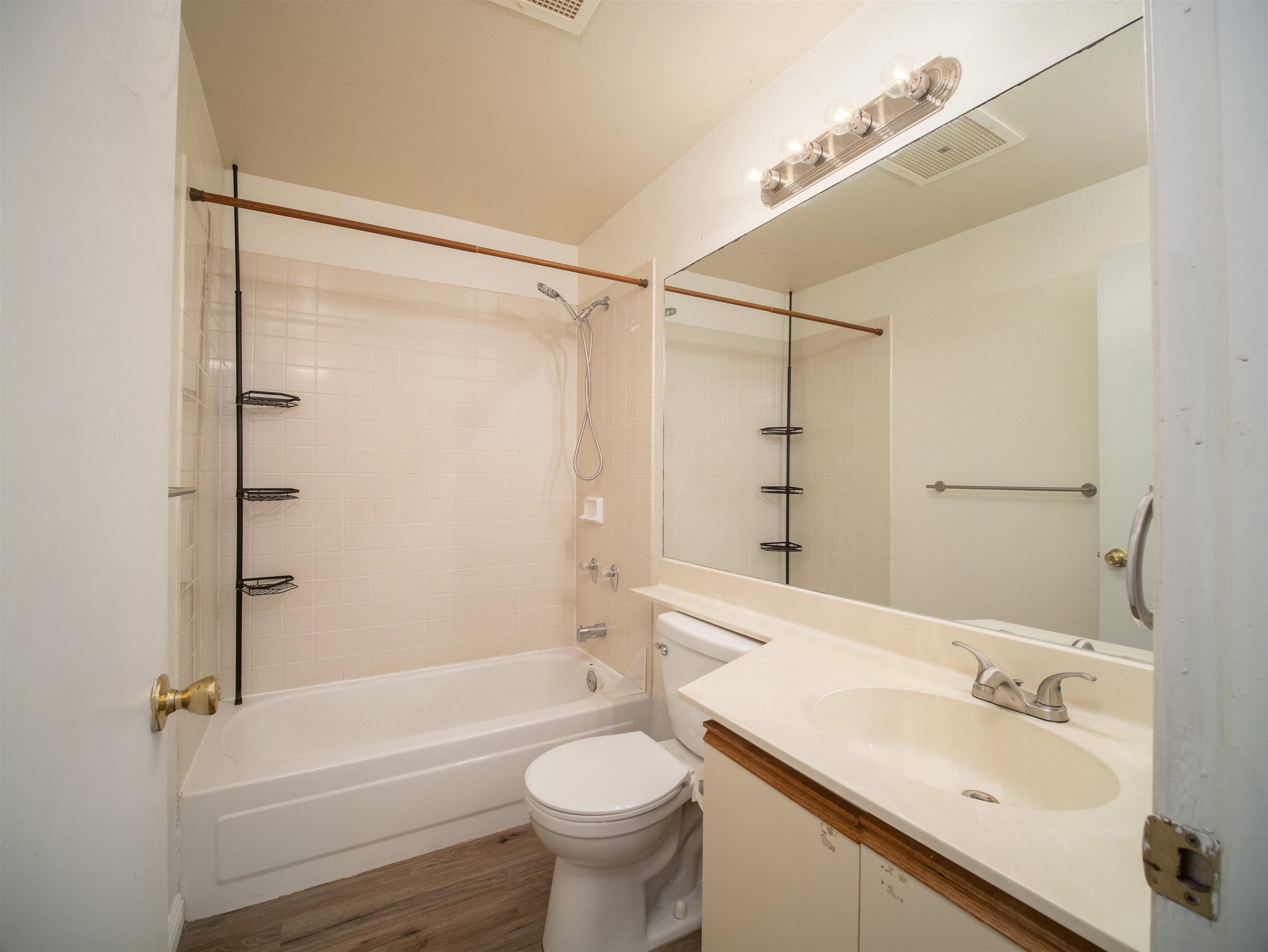 140 Uwapo Road, Unit 43204 Kihei, HI 96753 - Photo 14 of 21 a bathroom with a sink mirror toilet and bathtub