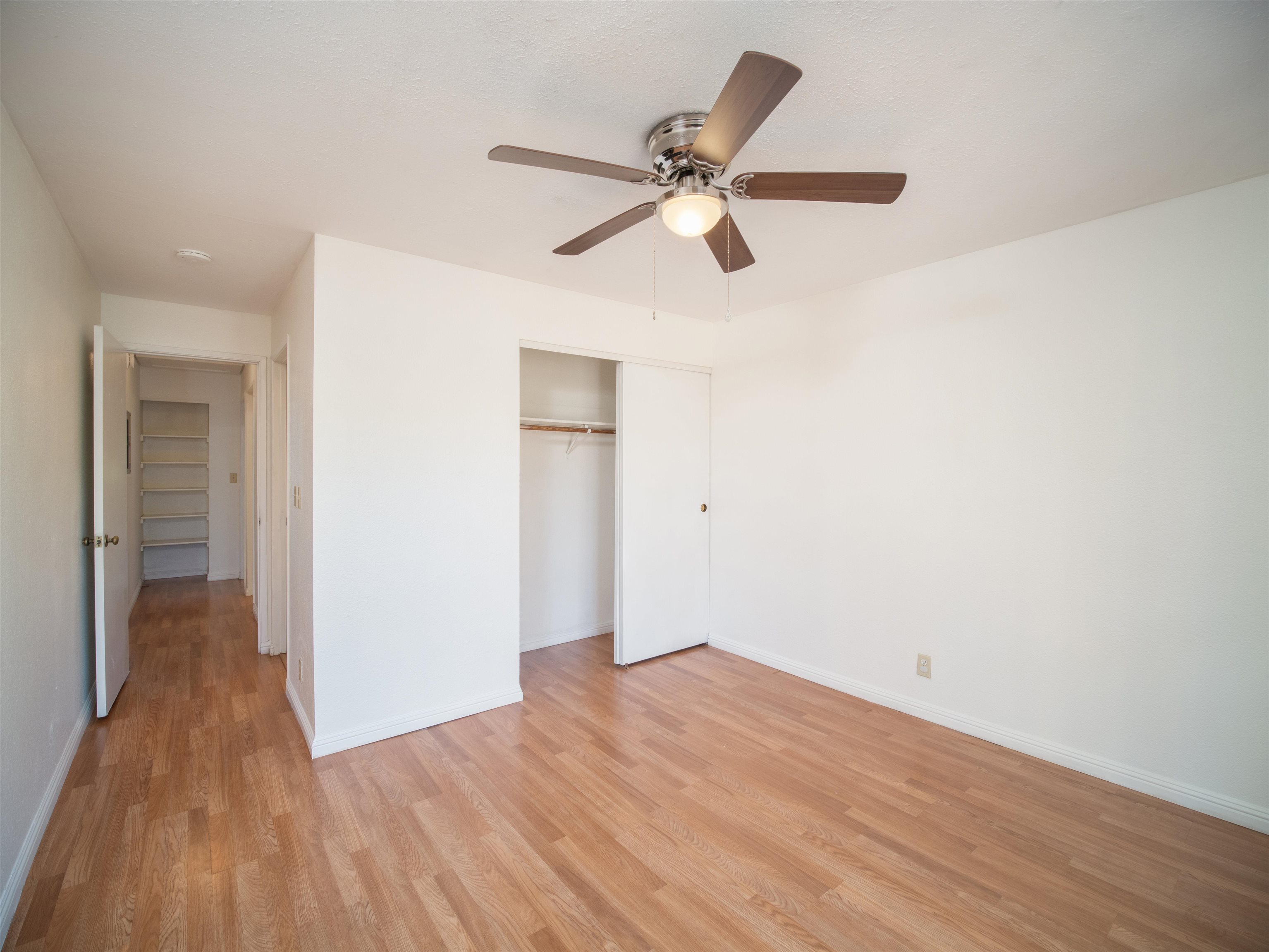 140 Uwapo Road, Unit 43204 Kihei, HI 96753 - Photo 9 of 21 a view of a room with wooden floor