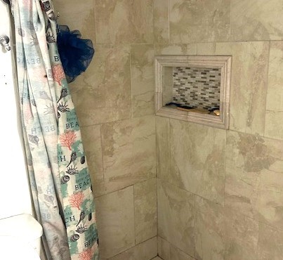 13046 Leader Street, Unit 976 Houston, TX 77072 - Photo 13 of 18 a bathroom with a shower