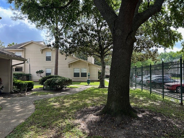 13046 Leader Street, Unit 976 Houston, TX 77072 - Photo 15 of 18 a view of house with backyard