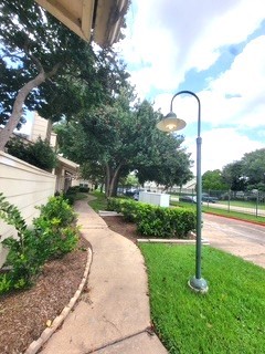 13046 Leader Street, Unit 976 Houston, TX 77072 - Photo 16 of 18 a park view with a fountain and a lake view