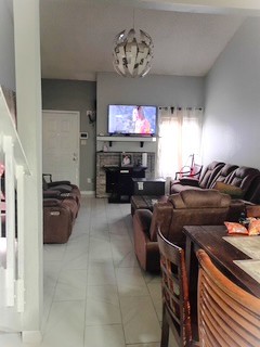 13046 Leader Street, Unit 976 Houston, TX 77072 - Photo 3 of 18 a living room with furniture and a flat screen tv