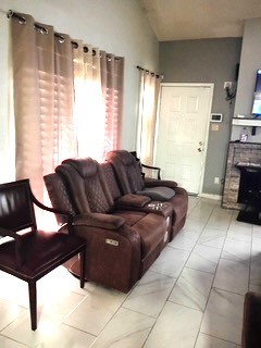 13046 Leader Street, Unit 976 Houston, TX 77072 - Photo 4 of 18 a living room with furniture and a fireplace