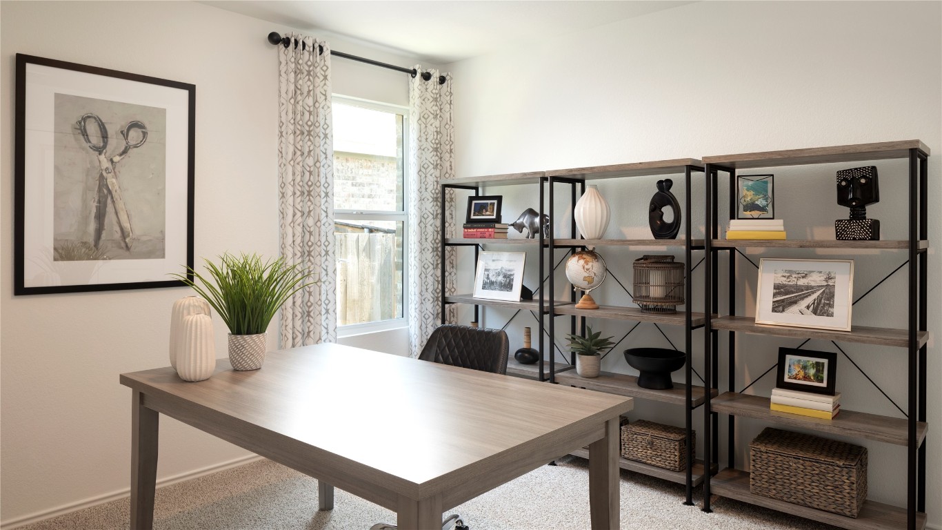 1409 Roaming Oak Bend Georgetown, TX 78628 - Photo 7 of 11 a view of a workspace with furniture and a potted plant