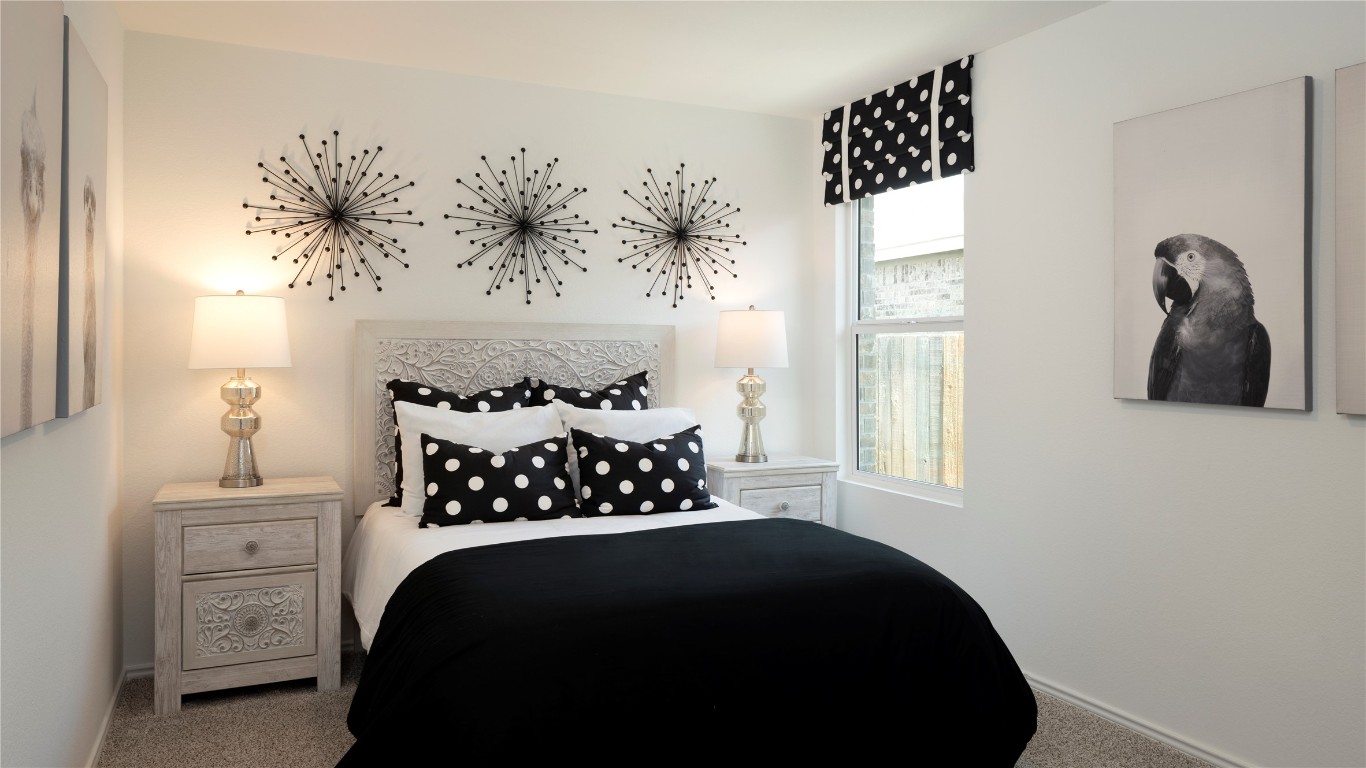 1409 Roaming Oak Bend Georgetown, TX 78628 - Photo 10 of 11 a bedroom with a bed and a window