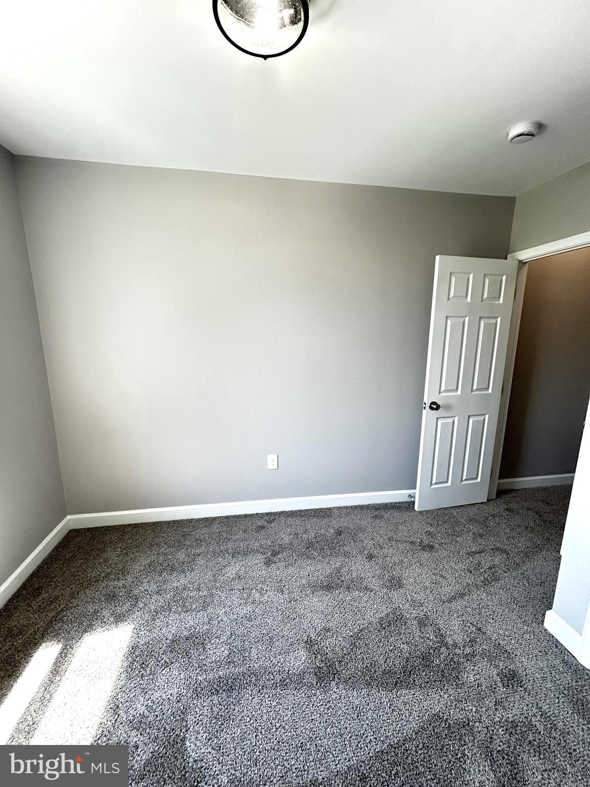2815 East Chase Street Baltimore, MD 21213 - Photo 18 of 40 a view of an empty room and window