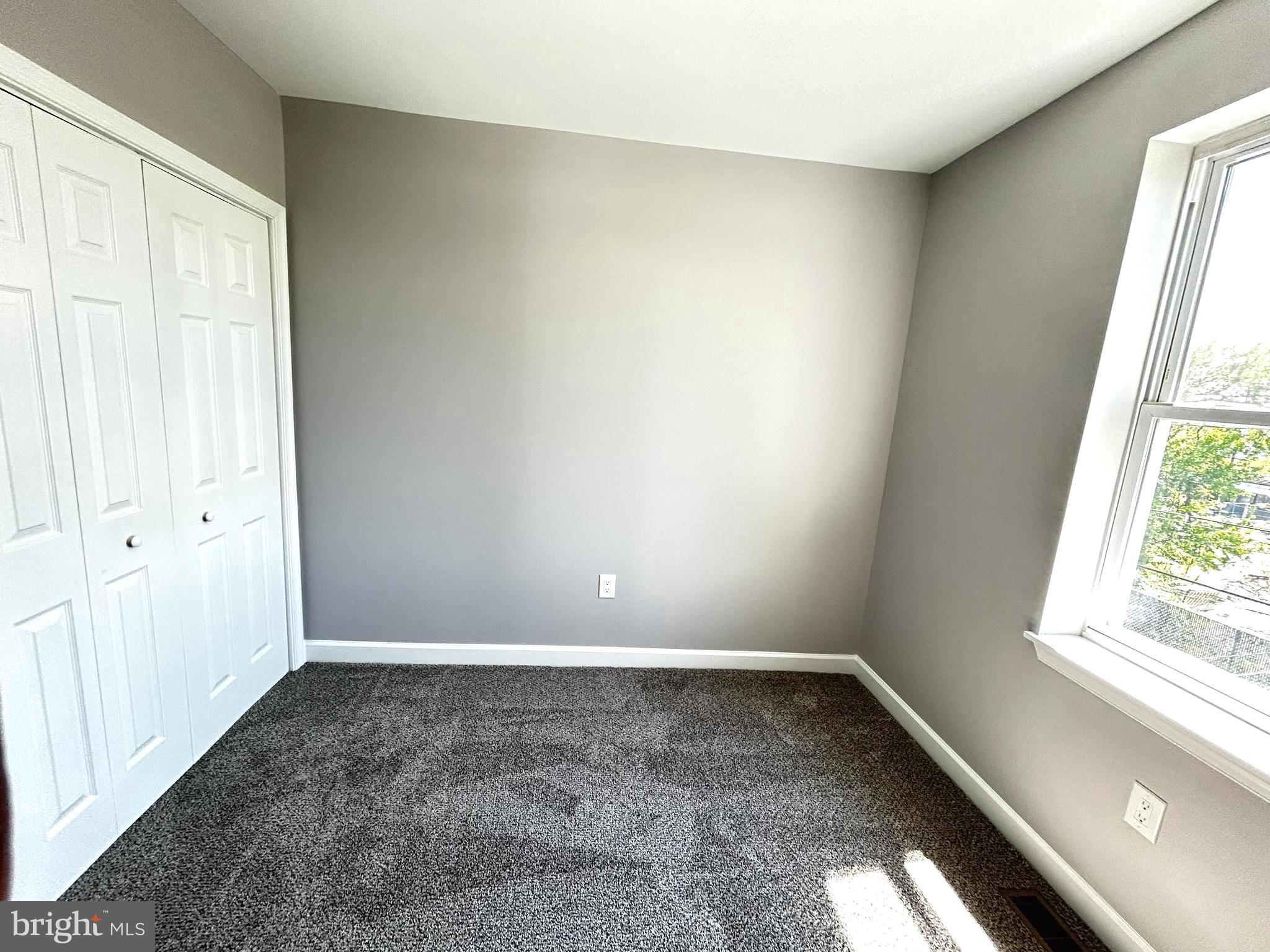 2815 East Chase Street Baltimore, MD 21213 - Photo 21 of 40 an empty room with a window