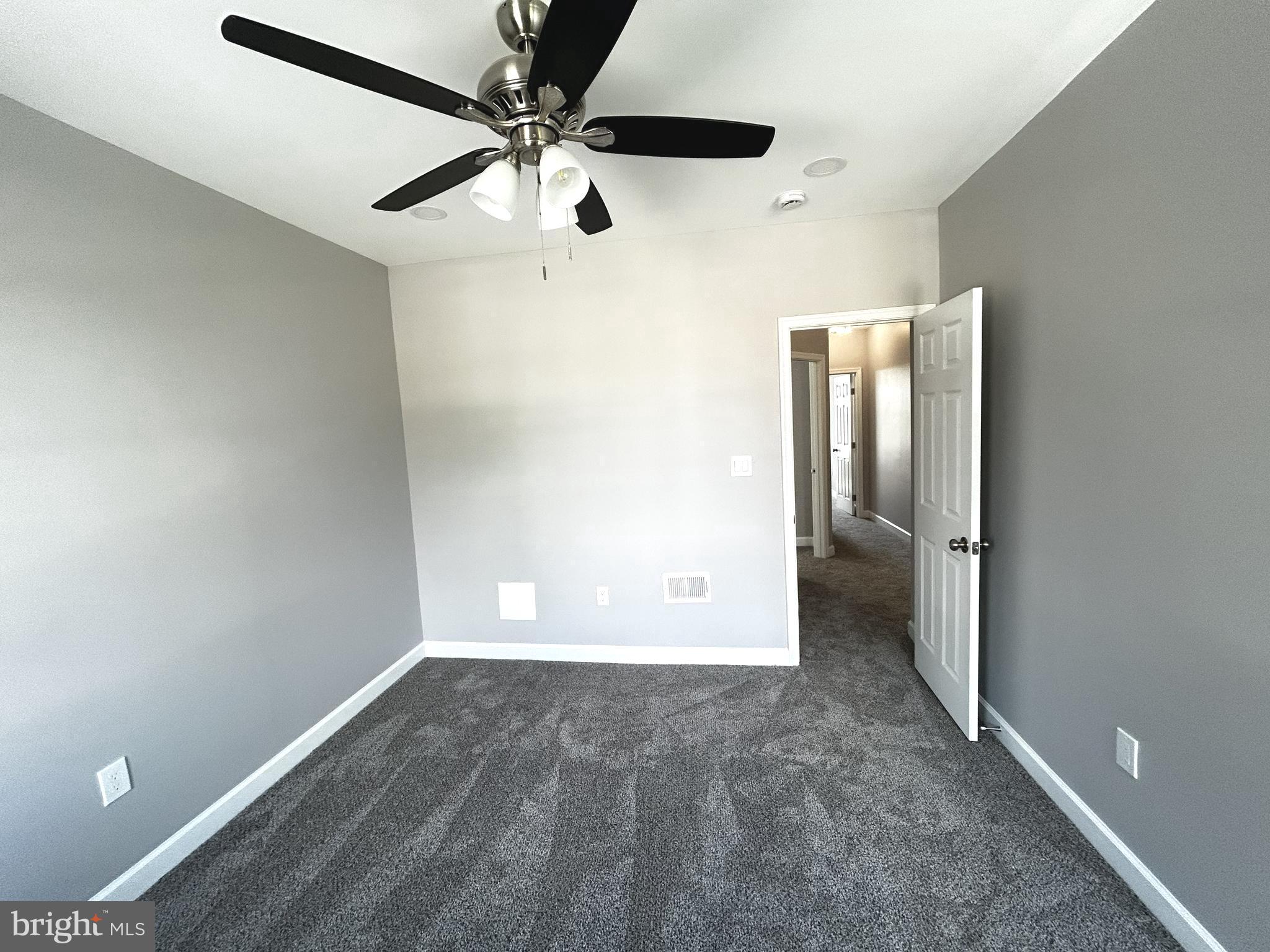 2815 East Chase Street Baltimore, MD 21213 - Photo 24 of 40 an empty room with a empty space and a ceiling fan