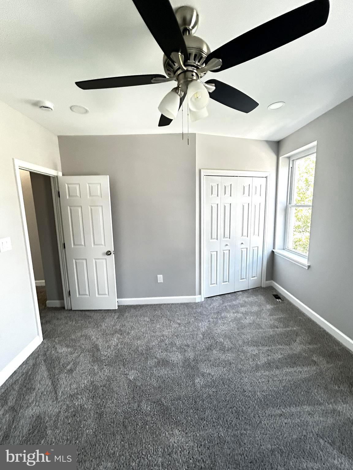 2815 East Chase Street Baltimore, MD 21213 - Photo 26 of 40 a view of an empty room and a window