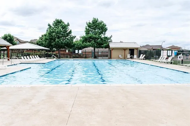 a view of a lake with houses in the back