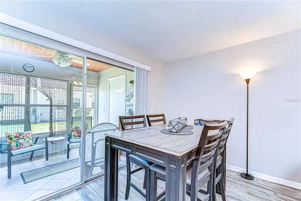 a view of a dining room with furniture window and outside view
