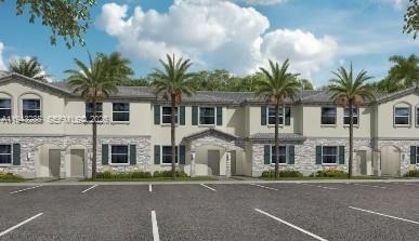 247 Southeast 10th Court Homestead, FL 33035 - Photo 1 of 1 a front view of a house with a yard and garage