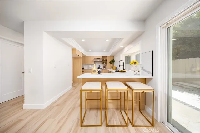 a spacious bathroom with a glass door shower and a sink