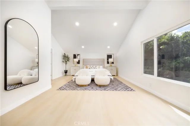 a bathroom with a double vanity sink mirror and bathtub