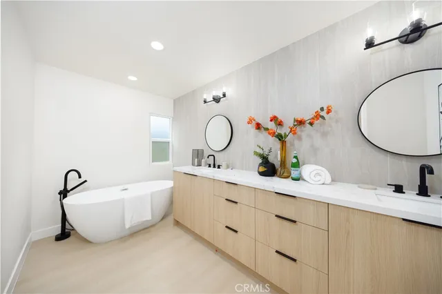 an aerial view of a house with a yard and garden in front of it