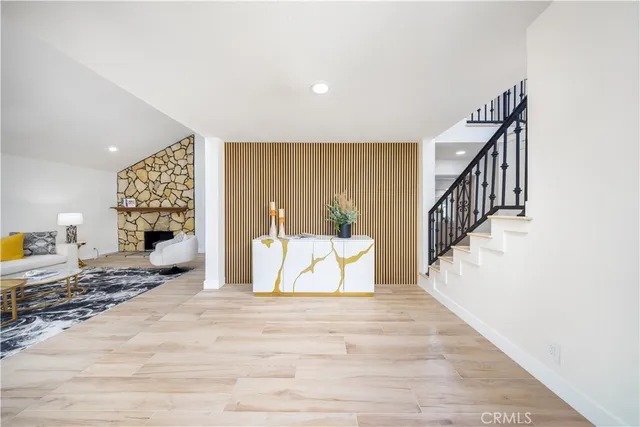 a view of a bedroom with furniture and staircase