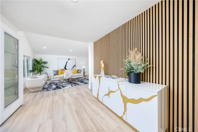 a view of a dining room with furniture and floor to ceiling window