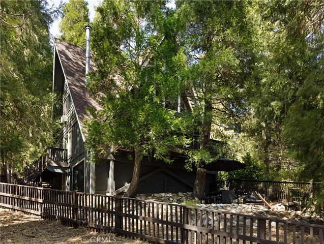 a view of street with wooden stairs and sitting area