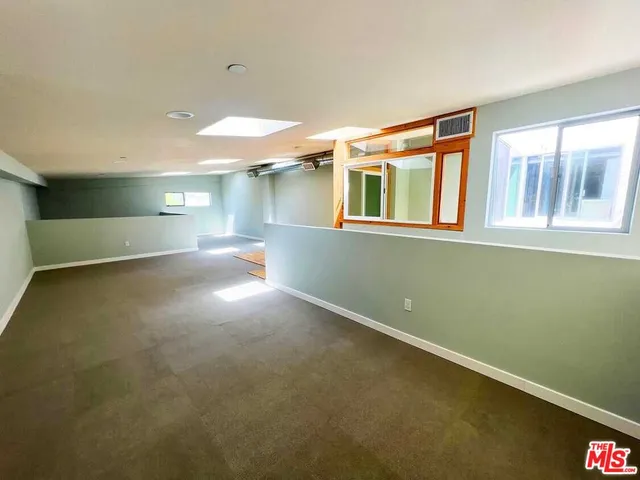 a view of empty room with windows