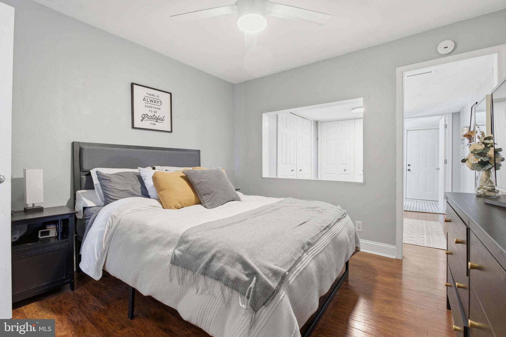 1433 Patapsco Street Baltimore, MD 21230 - Photo 12 of 26 a bedroom with bed and wooden floor